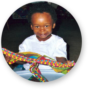 baby in walker with colorful toy